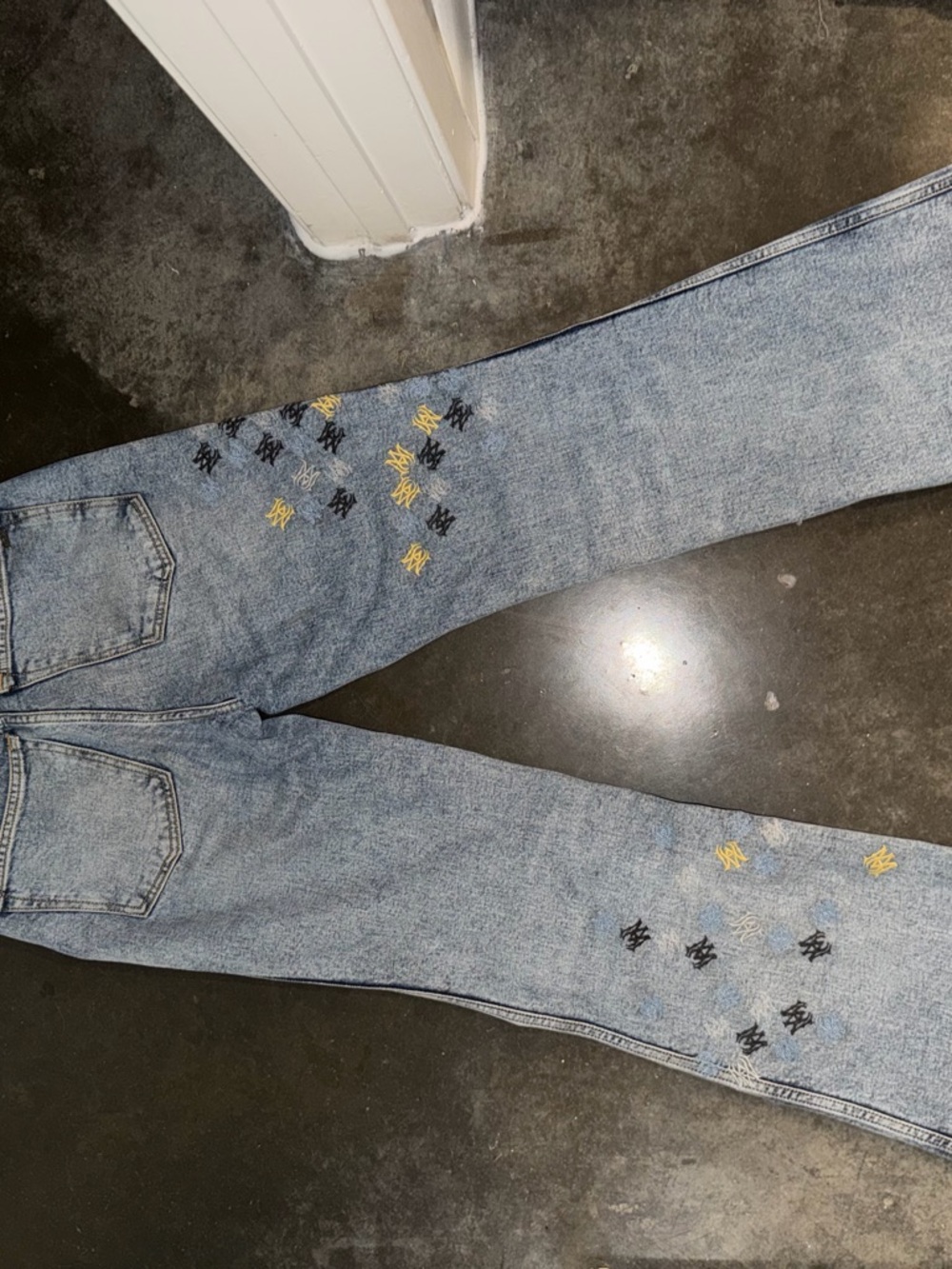 AMIRI Light Wash Straight-Leg Jeans with Yellow & Black Embroidery